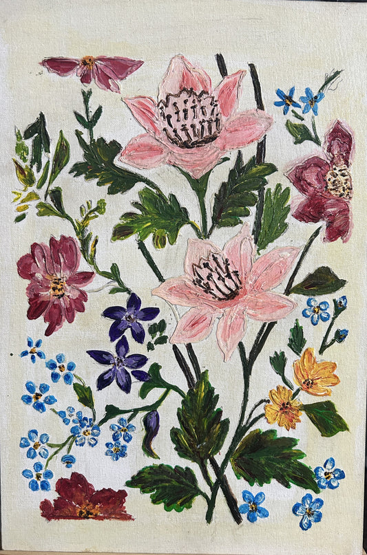 Colorful floral arrangement with pink, purple, and yellow flowers on a white background